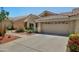Charming single-level home with a well-manicured lawn and a two-car garage, embodying curb appeal at 5830 E Mckellips Rd # 2, Mesa, AZ 85215