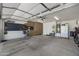 Garage with ample storage, work bench and tools with room for vehicle parking at 5830 E Mckellips Rd # 2, Mesa, AZ 85215