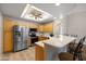 Modern kitchen features stainless steel appliances, sleek countertops, ample cabinet space, and a convenient breakfast bar at 5830 E Mckellips Rd # 2, Mesa, AZ 85215