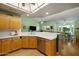 Kitchen with stainless steel appliances, white countertops, and wood cabinets at 5830 E Mckellips Rd # 2, Mesa, AZ 85215