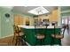 Bright kitchen with wood cabinetry, stainless steel appliances, and bar seating at 5830 E Mckellips Rd # 2, Mesa, AZ 85215