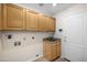 Functional laundry room with cabinetry, sink, and washer/dryer hookups at 5830 E Mckellips Rd # 2, Mesa, AZ 85215