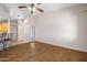 Spacious living room with high ceilings and hardwood floors, offering a versatile space for relaxation and entertainment at 5830 E Mckellips Rd # 2, Mesa, AZ 85215