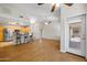 Open-concept living room with breakfast bar, stainless steel appliances, and bright, neutral paint at 5830 E Mckellips Rd # 2, Mesa, AZ 85215