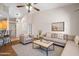 Inviting living room with vaulted ceilings, plush seating, and a stylish coffee table creates a warm and welcoming space at 5830 E Mckellips Rd # 2, Mesa, AZ 85215