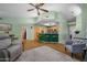 Spacious living room with wood floors, bar seating, and ceiling fan at 5830 E Mckellips Rd # 2, Mesa, AZ 85215