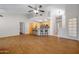 Spacious living area with hardwood floors, high ceilings, and a breakfast bar, ideal for modern living and entertaining at 5830 E Mckellips Rd # 2, Mesa, AZ 85215