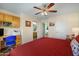 Bedroom with desk, ceiling fan, and view to a bathroom and another room at 5830 E Mckellips Rd # 2, Mesa, AZ 85215