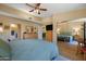Comfortable main bedroom features a ceiling fan, large bed, and mirrored closet doors at 5830 E Mckellips Rd # 2, Mesa, AZ 85215