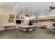 Large meeting room features ample seating, a TV, and neutral decor for versatile use at 5830 E Mckellips Rd # 2, Mesa, AZ 85215