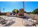 Outdoor grill and fireplace area with lounge chairs for enjoyable outdoor living at 5830 E Mckellips Rd # 2, Mesa, AZ 85215