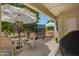 Shaded patio with tables, chairs, umbrella and grill with outdoor dining and entertaining space at 5830 E Mckellips Rd # 2, Mesa, AZ 85215