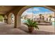 Covered patio with desert landscaping overlooking a gated community pool on a sunny day at 5830 E Mckellips Rd # 2, Mesa, AZ 85215