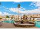Community pool with lounge chairs, palm trees, desert plants, and clear blue water at 5830 E Mckellips Rd # 2, Mesa, AZ 85215