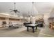 Spacious recreation room with pool table, ping pong table, and kitchen area at 5830 E Mckellips Rd # 2, Mesa, AZ 85215