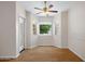 Bright room with hardwood floors and a bay window, offering natural light and a pleasant view of the outdoors at 5830 E Mckellips Rd # 2, Mesa, AZ 85215