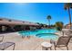 Resort-style pool and hot tub area surrounded by palm trees and comfortable seating at 5830 E Mckellips Rd # 2, Mesa, AZ 85215