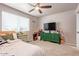 Bedroom featuring carpeted floors, ceiling fan, and natural light at 5913 E Thomas Rd, Scottsdale, AZ 85251