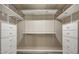 Walk-in closet with built-in shelving and drawers at 5913 E Thomas Rd, Scottsdale, AZ 85251