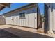 Side view of the condo showing the gated entrance with a welcome mat at 5913 E Thomas Rd, Scottsdale, AZ 85251