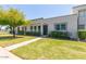 Attractive townhome with a well-maintained lawn and mature shade tree at 5913 E Thomas Rd, Scottsdale, AZ 85251