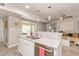 Updated kitchen with granite countertops, a stainless steel dishwasher, and open views to the living area at 5913 E Thomas Rd, Scottsdale, AZ 85251