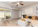 This open living room with a sliding glass door to a covered patio offers seamless indoor-outdoor living at 5913 E Thomas Rd, Scottsdale, AZ 85251