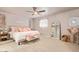 Bedroom featuring a comfy bed, bright light, and a big mirror at 5913 E Thomas Rd, Scottsdale, AZ 85251