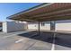 Assigned covered parking space with metal awning and storage unit at 5913 E Thomas Rd, Scottsdale, AZ 85251