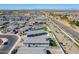 Aerial view showcases the neighborhood, emphasizing backyard swimming pools and desert landscape at 6117 S Adelle --, Mesa, AZ 85212