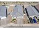 An aerial perspective showing a meticulously landscaped front yard and a welcoming paver driveway at 6117 S Adelle --, Mesa, AZ 85212
