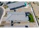 An aerial view shows a property with artificial grass, an outdoor seating area, and gravel landscaping at 6117 S Adelle --, Mesa, AZ 85212