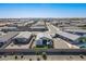 An aerial view of the home in a neighborhood, highlighting the manicured lawns and outdoor spaces at 6117 S Adelle --, Mesa, AZ 85212