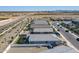 The aerial view highlights the backyards and homes in the neighborhood with mountain views in the distance at 6117 S Adelle --, Mesa, AZ 85212