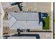 An aerial view of the roof showing the design with artificial turf in the backyard at 6117 S Adelle --, Mesa, AZ 85212