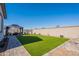 Features a manicured backyard with artificial turf, patio furniture, and a gazebo for relaxing at 6117 S Adelle --, Mesa, AZ 85212