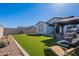 Spacious backyard with a gazebo, artificial turf, and seating, perfect for outdoor entertaining and relaxation at 6117 S Adelle --, Mesa, AZ 85212