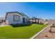 Wide backyard showcasing the gazebo with seating, artificial turf, and hardscape, making it ideal for outdoor living at 6117 S Adelle --, Mesa, AZ 85212