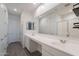 Spacious bathroom boasting dual sinks, ample counter space, and a glass-enclosed shower at 6117 S Adelle --, Mesa, AZ 85212