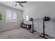 Neutral bedroom featuring a mirror, window, carpet, and weight-lifting equipment at 6117 S Adelle --, Mesa, AZ 85212