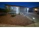 Charming single-story home featuring a well-manicured front yard with desert landscaping and a paved driveway at 6117 S Adelle --, Mesa, AZ 85212