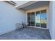 Cozy patio featuring two chairs, a side table, and a view into the home at 6117 S Adelle --, Mesa, AZ 85212