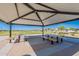 Community pavilion with tables and benches for outdoor enjoyment and neighborhood gatherings at 6117 S Adelle --, Mesa, AZ 85212