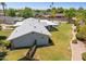 Spacious backyard featuring a pristine pool, lush lawn, and privacy fencing with mature trees at 7042 N 13Th St, Phoenix, AZ 85020