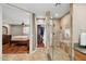 Bathroom features a glass-enclosed shower with views to the main bedroom at 7042 N 13Th St, Phoenix, AZ 85020