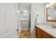 Updated bathroom featuring granite vanity, bright natural light, and neutral tile at 7042 N 13Th St, Phoenix, AZ 85020