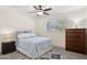 Charming bedroom with large window, ceiling fan, and classic furnishings at 7042 N 13Th St, Phoenix, AZ 85020