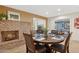 Dining room with brick fireplace and wood table and chairs, ideal for entertaining at 7042 N 13Th St, Phoenix, AZ 85020