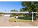 Well-kept single-story home featuring a manicured front yard, vibrant flower beds, and an attached garage at 7042 N 13Th St, Phoenix, AZ 85020