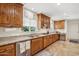 Well-appointed kitchen with custom wood cabinetry, granite countertops, and modern stainless steel appliances at 7042 N 13Th St, Phoenix, AZ 85020